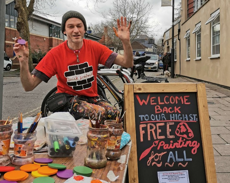 Access support worker and artist facilitating creative practice – helping fill application forms and organise artwork